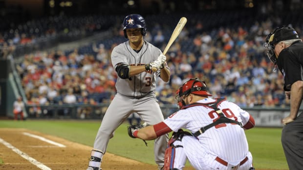 Houston Astros Norichika Aoki stands at the plate besides a Phillies catcher
